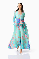 Brunette model wearing the Coral Long Sleeve Maxi Dress in Blue Multi posed shot 