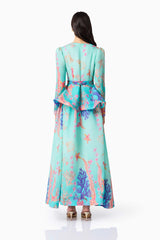 Brunette model wearing the Coral Long Sleeve Maxi Dress in Blue Multi back shot 