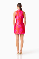 Brunette model wearing the Sunbeam Mini Dress in Pink & Red back shot