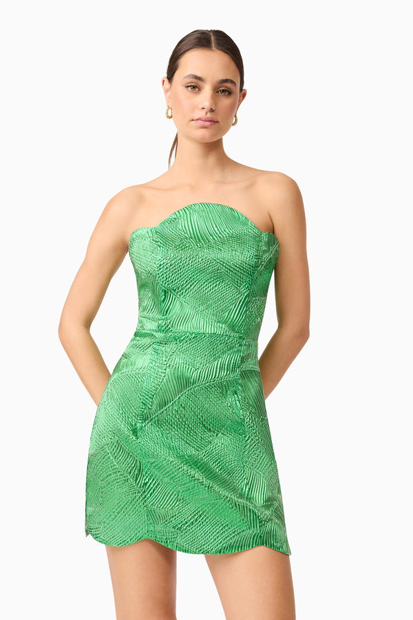 Brunette model wearing Ginnifer Strapless Mini Dress in Green close-up shot
