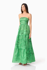 Brunette model wearing Ginnifer Strapless Maxi Dress in Green side shot