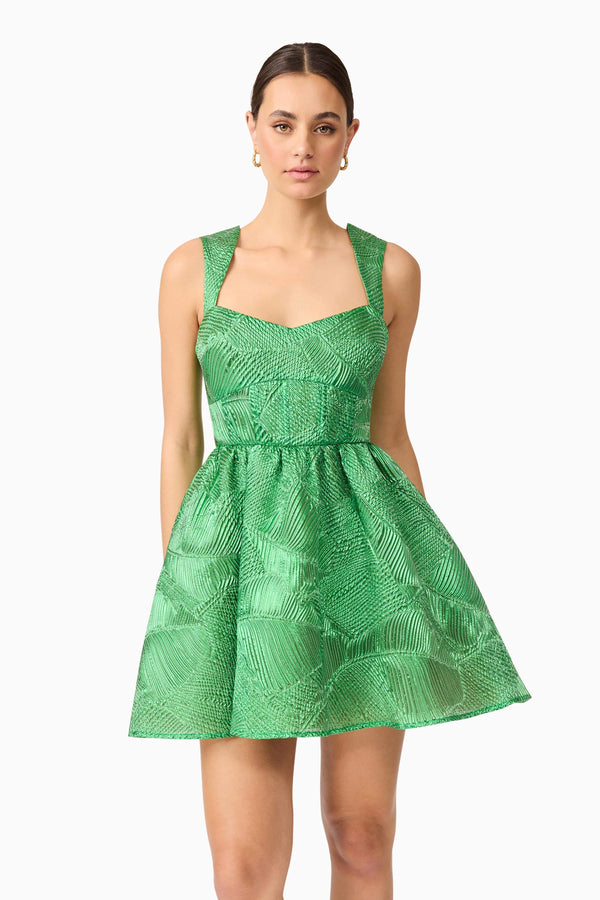 Brunette model wearing Ginnifer A-Line Mini Dress in Green close-up shot