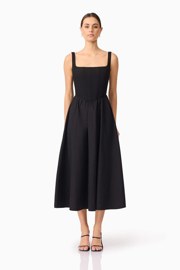 Brunette model wearing Ingrid Corset Midi Dress in Black front shot