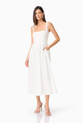 Brunette model wearing Ingrud Corset Midi Dress in White posed shot