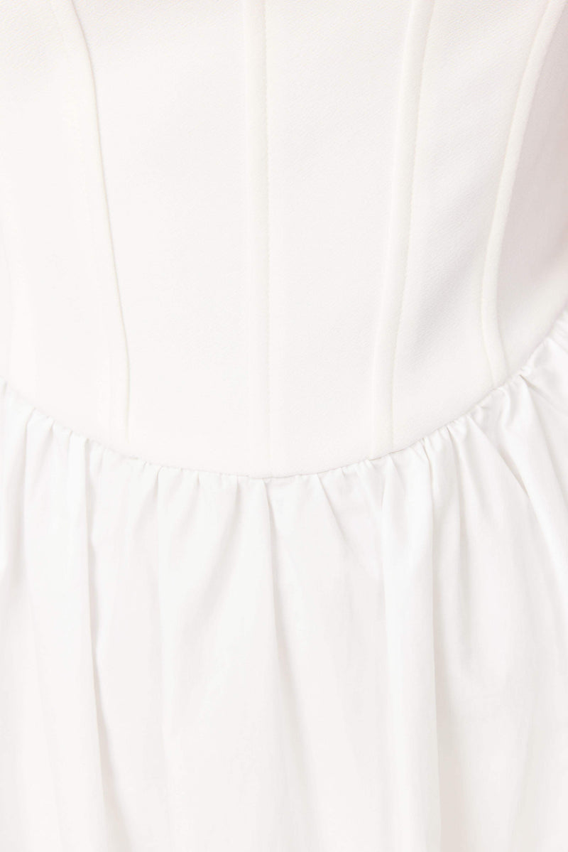 Brunette model wearing Ingrud Corset Midi Dress in White detail shot