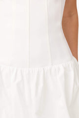 Brunette model wearing Ingrid Bubble Mini Dress in White detail shot