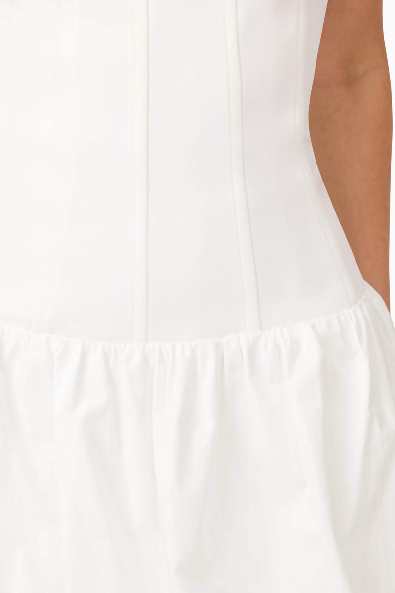 Brunette model wearing Ingrid Bubble Mini Dress in White detail shot