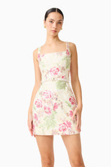 Brunette model wearing the Greta Embroidered Mini Dress in Cream & Pink Floral close up shot