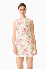 Brunette model wearing the Greta Embroidered Set in Cream & Pink Floral close up shot
