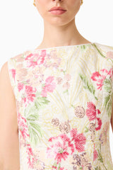 Brunette model wearing the Greta Embroidered Set in Cream & Pink Floral detail shot