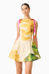 Brunette model wearing the Lilia A-Line Mini Dress in Multi Floral close up shot