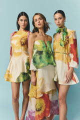 Brunette model wearing the Lilia Long Sleeve Mini Dress in Multi Floral campaign shot 