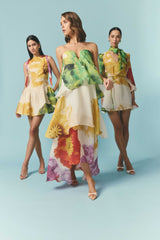 Brunette model wearing the Lilia Tiered Gown in Multi Floral campaign shot 