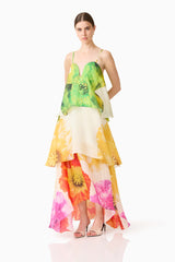 Brunette model wearing the Lilia Tiered Gown in Multi Floral posed shot 