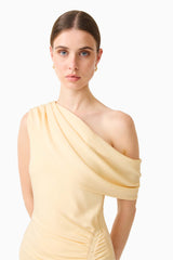Brunette model wearing the Simone One Shoulder Maxi Dress in Butter Yellow detail shot