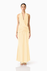 Brunette model wearing the 
Simone Cowl Neck Gown in Butter Yellow front shot
