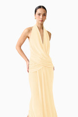 Brunette model wearing the 
Simone Cowl Neck Gown in Butter Yellow close up shot