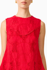 Brunette model wearing the Giovanna Shift Mini Dress in Red detail shot
