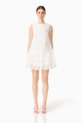 Brunette model wearing the Giovanna Shift Mini Dress in White front shot