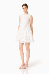 Brunette model wearing the Giovanna Shift Mini Dress in White posed shot