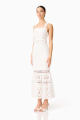 Brunette model wearing the Giovanna Fit & Flare Maxi Dress in White side shot