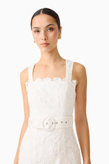 Brunette model wearing the Giovanna Fit & Flare Maxi Dress in White Detail shot