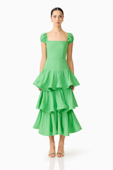 Brunette model wearing the Emilie Tiered Maxi Dress in Kelly Green front shot