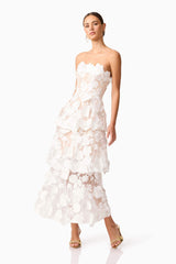 Brunette model wearing Selene Maxi Tiered 3D Dress in White side shot