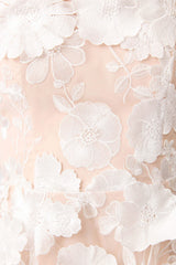 Brunette model wearing Selene Maxi Tiered 3D Dress in White detail shot