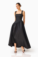 Brunette model wearing the Ruelle A-Line Maxi Dress in Black side shot