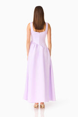 Brunette model wearing the Ruelle A-Line Maxi Dress in Purple back shot 