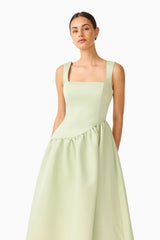 Brunette model wearing the Ruelle A-Line Maxi Dress in Sage Green close up shot 