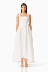 Brunette model wearing the Ruelle A-Line Maxi Dress in Pearl White front shot 