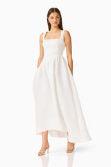 Brunette model wearing the Ruelle A-Line Maxi Dress in Pearl White posed shot 
