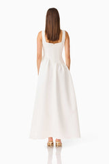 Brunette model wearing the Ruelle A-Line Maxi Dress in Pearl White back shot 