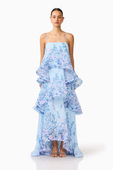 Brunette model wearing the Tilly Tiered Maxi Dress in Blue Floral front shot