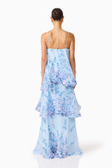 Brunette model wearing the Tilly Tiered Maxi Dress in Blue Floral back shot