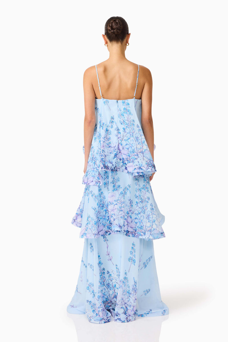 Brunette model wearing the Tilly Tiered Maxi Dress in Blue Floral back shot