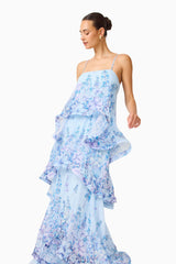 Brunette model wearing the Armani Tiered Maxi Dress in Baby Blue Floral posed looking away shot