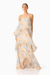 Brunette model wearing the Tilly Tiered Maxi Dress in Yellow Floral posed shot