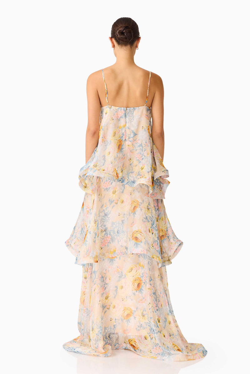 Brunette model wearing the Tilly Tiered Maxi Dress in Yellow Floral back shot