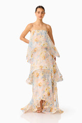 Brunette model wearing the Tilly Tiered Maxi Dress in Yellow Floral posed hand on hip shot