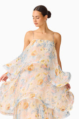 Brunette model wearing the Tilly Tiered Maxi Dress in Yellow Floral close up shot