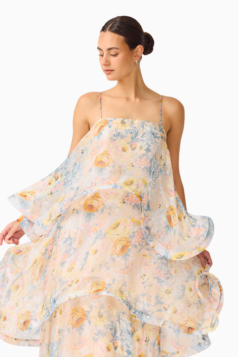 Brunette model wearing the Tilly Tiered Maxi Dress in Yellow Floral close up shot