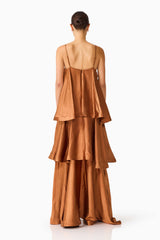 Brunette model wearing the Tilly Tiered Maxi Dress in Brown back shot 