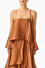 Brunette model wearing the Tilly Tiered Maxi Dress in Brown detail shot 