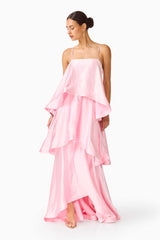 Brunette model wearing the Tilly Tiered Maxi Dress in Pale Pink posed looking away shot