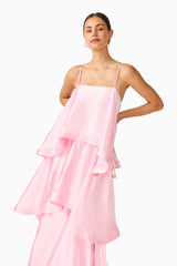 Brunette model wearing the Tilly Tiered Maxi Dress in Pale Pink close up shot