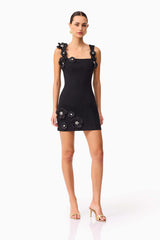 Brunette model wearing Chantelle Floral Mini Dress in Black posed shot