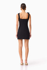 Brunette model wearing Chantelle Floral Mini Dress in Black back shot